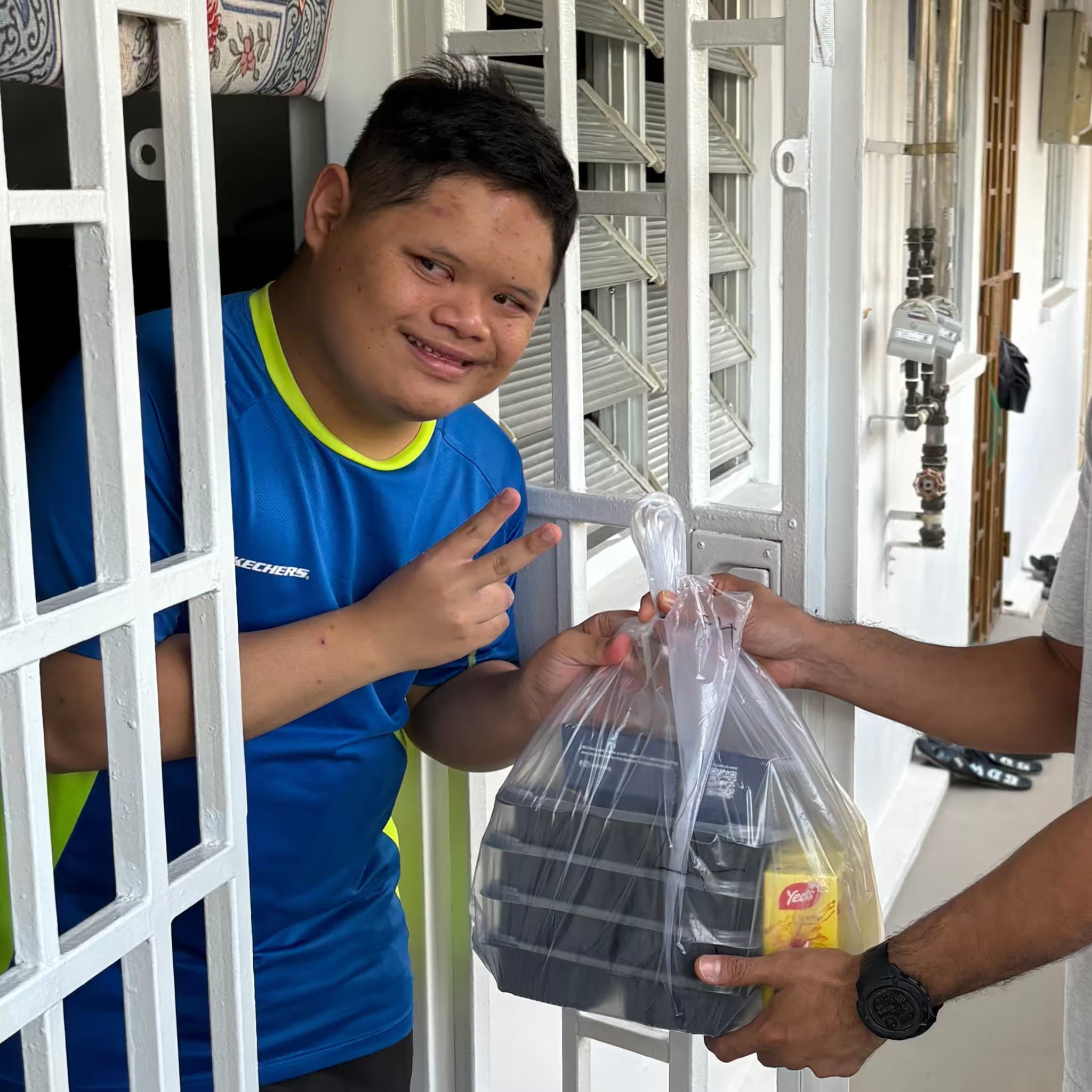 Special Needs Student receiving food 